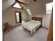 Cozy bedroom with a floral comforter and mountain view at 4924 S Indian Trl, Evergreen, CO 80439
