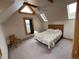 Bright bedroom with a queen-size bed and wood floors at 4924 S Indian Trl, Evergreen, CO 80439