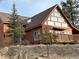 Wooden cabin with a-frame design and mountain views at 4924 S Indian Trl, Evergreen, CO 80439