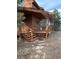 Wooden home with stairs leading to a porch at 4924 S Indian Trl, Evergreen, CO 80439