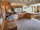 Spacious kitchen with wooden cabinets and island at 4924 S Indian Trl, Evergreen, CO 80439