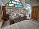 Sunlit living room with ample seating and large windows at 4924 S Indian Trl, Evergreen, CO 80439