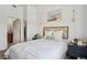 Comfortable bedroom showcases decor, plush bedding, bedside tables and an ensuite bathroom at 1700 N Emerson St # 305, Denver, CO 80218