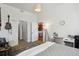Bedroom with view to desk, kitchen, closet and musical instuments displayed on wall at 1700 N Emerson St # 305, Denver, CO 80218