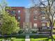 Attractive brick building with well-kept grounds and inviting front entrance at 1700 N Emerson St # 305, Denver, CO 80218