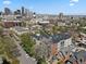 Scenic aerial view with the building situated near the downtown skyline at 1700 N Emerson St # 305, Denver, CO 80218