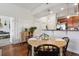 Open-concept space featuring dining area and view to the kitchen at 1700 N Emerson St # 305, Denver, CO 80218