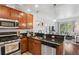 Well-appointed kitchen featuring stainless steel appliances and a seamless view into the living space at 1700 N Emerson St # 305, Denver, CO 80218