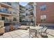 Exterior of the building featuring a common outdoor patio area at 1700 N Emerson St # 305, Denver, CO 80218