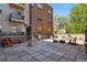 Exterior of the building featuring a common outdoor patio area at 1700 N Emerson St # 305, Denver, CO 80218
