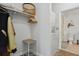 A closet with a washer/dryer that leads to a bathroom is conveniently located within this modern condo at 1700 N Emerson St # 305, Denver, CO 80218