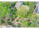Aerial view of a beautifully landscaped backyard with a garden and mature trees, perfect for outdoor relaxation at 3014 E Fremont Dr, Centennial, CO 80122