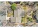 Aerial view of the backyard featuring a patio, landscaping, and mature trees, offering a private outdoor retreat at 3014 E Fremont Dr, Centennial, CO 80122