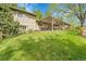 Expansive backyard with a deck and pergola, providing a serene outdoor living space at 3014 E Fremont Dr, Centennial, CO 80122