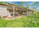 Backyard featuring a spacious deck with pergola, outdoor seating, and a lush lawn at 3014 E Fremont Dr, Centennial, CO 80122