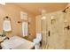 Bathroom featuring a vanity, a toilet, and a walk-in shower with glass door at 3014 E Fremont Dr, Centennial, CO 80122