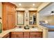Bathroom featuring a dual-sink vanity with granite countertop, and access to the main bedroom at 3014 E Fremont Dr, Centennial, CO 80122