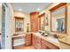 Bathroom vanity features double sinks, granite countertops, and wood cabinets at 3014 E Fremont Dr, Centennial, CO 80122