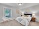 Bedroom with a large window, queen bed, and two bedside tables at 3014 E Fremont Dr, Centennial, CO 80122