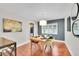 Bright dining room with stylish decor, modern lighting, and a beautifully set wooden table for memorable meals at 3014 E Fremont Dr, Centennial, CO 80122