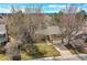 Inviting exterior elevation featuring mature landscaping and a two-car garage, blending classic charm with modern convenience at 3014 E Fremont Dr, Centennial, CO 80122