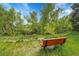 Scenic view of a wooden bench in a greenbelt, offering a serene spot to enjoy nature at 3014 E Fremont Dr, Centennial, CO 80122
