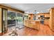 Open kitchen features bar seating, wood cabinets and stainless steel appliances at 3014 E Fremont Dr, Centennial, CO 80122