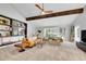 Spacious living room with a high ceiling, modern decor, and large windows for plenty of natural light at 3014 E Fremont Dr, Centennial, CO 80122
