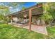 Inviting outdoor patio with comfortable seating, pergola, and a serene water fountain, perfect for entertaining at 3014 E Fremont Dr, Centennial, CO 80122