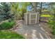 Backyard shed with a gravel path surrounded by landscaping, offering practical outdoor storage at 3014 E Fremont Dr, Centennial, CO 80122