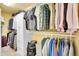 Walk-in closet with clothing racks and shelves for organized storage at 3014 E Fremont Dr, Centennial, CO 80122
