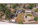 Aerial view of the property highlighting the large fenced yard, detached garage, and neighborhood surroundings at 1742 S Alcott St, Denver, CO 80219