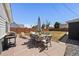 Spacious backyard with a patio, dining set, and grill, perfect for entertaining at 1742 S Alcott St, Denver, CO 80219
