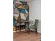 Cozy dining area with stylish chairs and artistic geometric wall design at 1742 S Alcott St, Denver, CO 80219