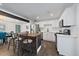 Bright kitchen with stainless steel appliances, white cabinets, and island seating for four at 1742 S Alcott St, Denver, CO 80219