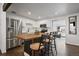 Modern kitchen featuring stainless steel appliances, white cabinets and central island at 1742 S Alcott St, Denver, CO 80219