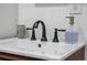 Close up of a sink with a gooseneck faucet and ceramic backsplash at 1742 S Alcott St, Denver, CO 80219