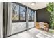 Sunlit bedroom featuring large windows with exterior views and dark accent wall at 1050 N Corona St # 206, Denver, CO 80218