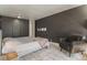 Bedroom featuring dark accent wall, built in closet and neutral furniture at 1050 N Corona St # 206, Denver, CO 80218