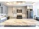 Bright kitchen features gray cabinets, subway tile backsplash, and center island with marble countertop at 1050 N Corona St # 206, Denver, CO 80218