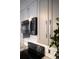 Close up of modern kitchen, featuring stainless steel microwave and range with gray cabinets and white subway tile backsplash at 1050 N Corona St # 206, Denver, CO 80218