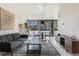Bright, stylish living room offers a comfortable seating arrangement and modern decor at 1050 N Corona St # 206, Denver, CO 80218