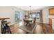 Dining area featuring a wooden table and sliding glass door, offering natural light at 5017 Ceylon St, Denver, CO 80249