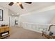 Upstairs loft featuring a ceiling fan and sitting area at 5017 Ceylon St, Denver, CO 80249