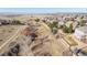 Aerial view of property with adjacent walking trail and green trees at 3125 Starling Ct, Castle Rock, CO 80109