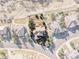 Aerial view showing the home's lot outlined; nestled on a tree-lined street at 3125 Starling Ct, Castle Rock, CO 80109