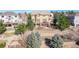 Backyard with stone retaining wall, green trees and lawn at 3125 Starling Ct, Castle Rock, CO 80109