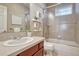 Clean bathroom with tiled vanity, modern fixtures, and glass-enclosed shower at 3125 Starling Ct, Castle Rock, CO 80109
