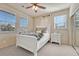 Bright bedroom with white furniture, neutral decor, and plenty of natural light at 3125 Starling Ct, Castle Rock, CO 80109