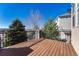 Well-maintained wooden deck with black metal railings, offering serene views at 3125 Starling Ct, Castle Rock, CO 80109